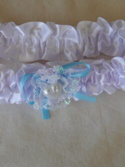 white garter with blue ribbon & pearl