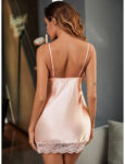 model shows back image of pink satin chemise fitted with fine spaghetti shoulder straps