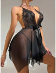 Babydoll Lingerie model wears super sexy low cut black babydoll with handkerchief skirt tie ribbon front and see through to thong sexy